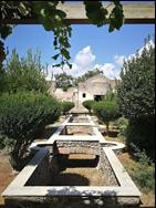 Kitchen frescoes from the Villa of Julia Felix on either side of the water feature in the garden